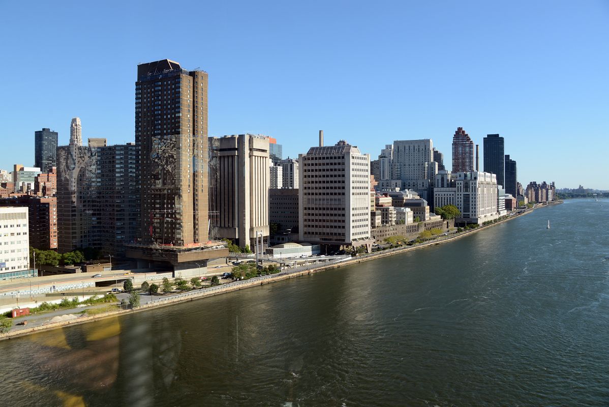 11 New York City Roosevelt Island Tramway Looking To Upper East Side Next To East River With Rockefeller University, Presbyterian Weill Cornell Medical Center, The Belaire, One East River Place